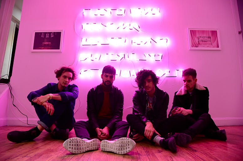 George Daniel, Ross MacDonald, Matthew Healy and Adam Hann of The 1975 appear during the The 1975 album release pop-up for "I Like It When You Sleep, For You Are So Beautiful Yet So Unaware Of It" on February 25, 2016 in New York City. (Photo by Theo Warg