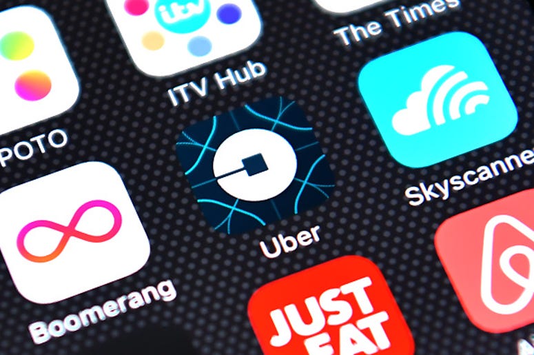 The Uber app logo is displayed on an iPhone on August 3, 2016 in London, England. (Photo by Carl Court/Getty Images)