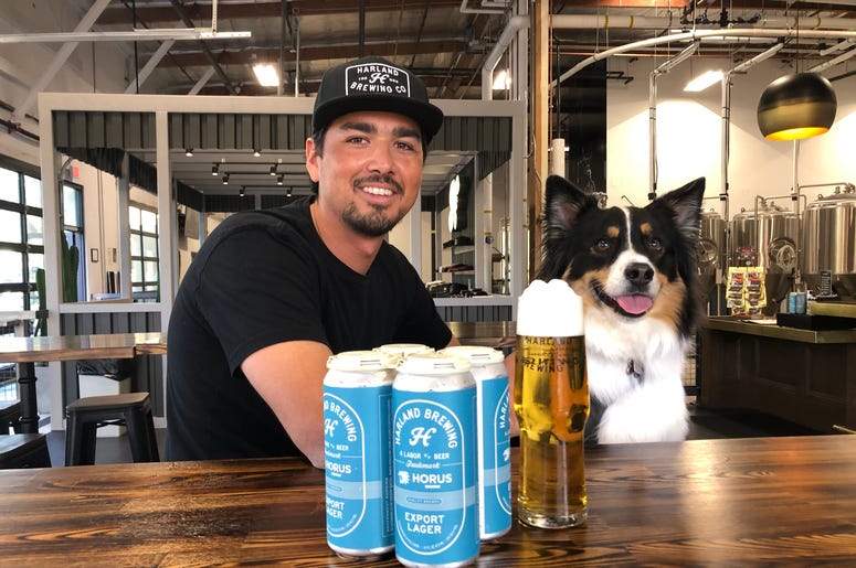 Harland Head Brewer Ryan Alvarez and Koda share a Harland Export Lager Harland Head Brewer Ryan Alvarez and Koda share a Harland Export Lager