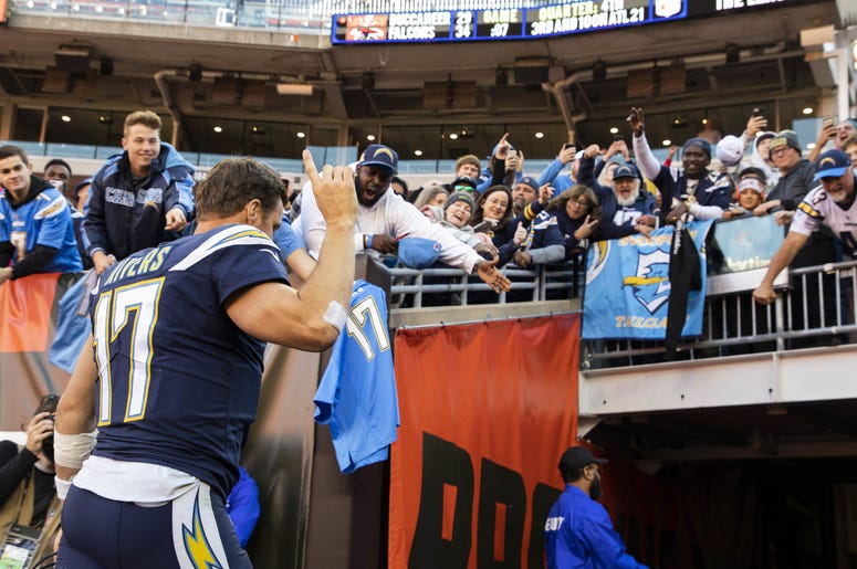 Oct 14, 2018; Cleveland, OH, USA; Los Angeles Chargers quarterback Philip Rivers (17) waves to fans as he leaves the field after the game against the Cleveland Browns at FirstEnergy Stadium. The Chargers won 38-14. Mandatory Credit: Scott R. Galvin-USA TO NFL: Los Angeles Chargers at Cleveland Browns