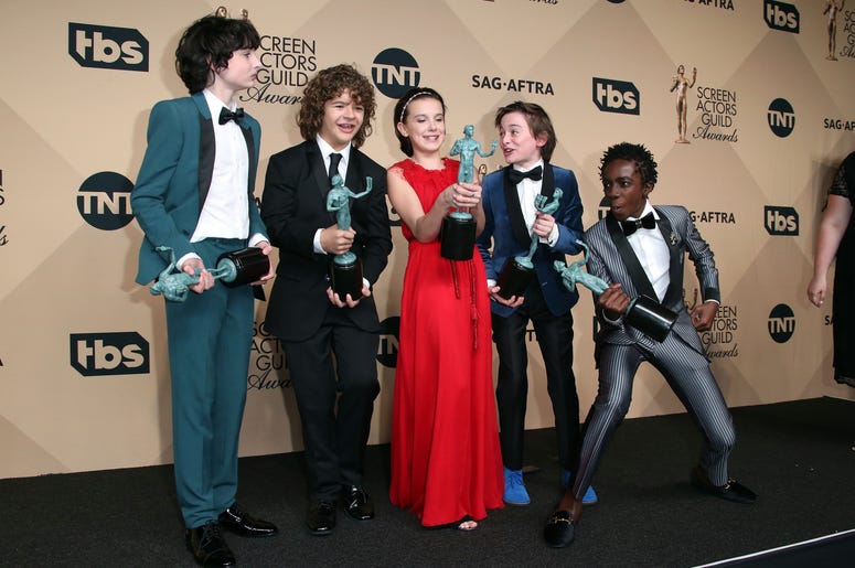 Jan 29, 2017; Los Angeles, CA, USA; (From left to right) Finn Wolfard, Gaten Matarazzo, Millie Bobby Brown, Noah Schapp and Caleb McLaughlin pose with their awards for Outstanding Ensemble in a Drama Series award for 'Stranger Things' in the photo room at Entertainment: 23rd Annual Screen Actors Guild Awards