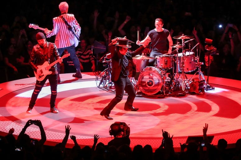 U2 perform on stage at the U2 eXPERIENCE + iNNOCENCE Tour. The O2 Arena, London U2 perform on stage at the U2 eXPERIENCE + iNNOCENCE Tour. The O2 Arena, London
