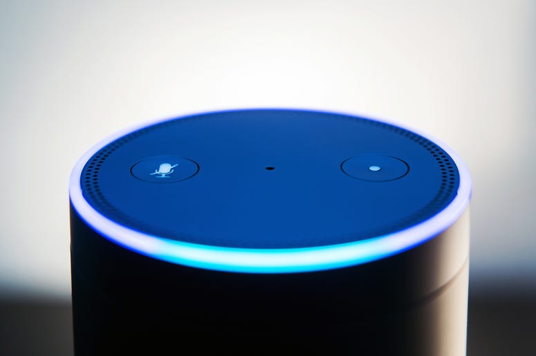 Amazon echo voice recognition system, selective focus and dark backdrop for impact of light ring Amazon echo voice recognition system, selective focus and dark backdrop for impact of light ring