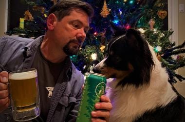 Ken tries to decide if Koda is going to be naughty or nice as his pup eyes a can of Pine Bomb IPA Ken tries to decide if Koda is going to be naughty or nice as his pup eyes a can of Pine Bomb IPA