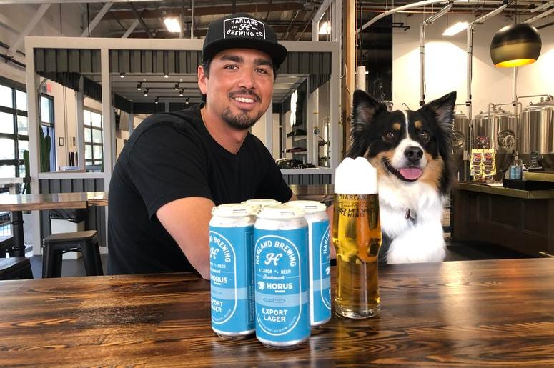Harland Head Brewer Ryan Alvarez and Koda share a Harland Export Lager Harland Head Brewer Ryan Alvarez and Koda share a Harland Export Lager