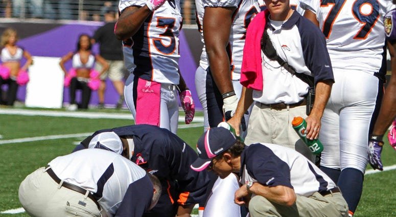 Denver Broncos kick returner Demaryius Thomas (88) is treated by medical staff after suffering a concussion during the game against the Baltimore Ravens at M&T Bank Stadium. Denver Broncos Demaryius Thomas (88) is treated by medical staff after suffering a concussion during the game against the Baltimore Ravens at M&T Bank Stadium.