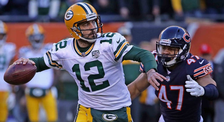 Aaron Rodgers Packers Bears Green Bay Packers quarterback Aaron Rodgers looks to throw a pass in a game against the Chicago Bears in 2018.