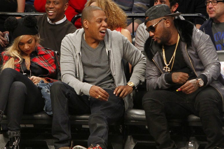 Beyonce, Jay Z and Young Jeezy react during the game between the Philadelphia 76ers and Brooklyn Nets at Barclays Center. Beyonce, Jay Z and Young Jeezy react during the game between the Philadelphia 76ers and Brooklyn Nets at Barclays Center.