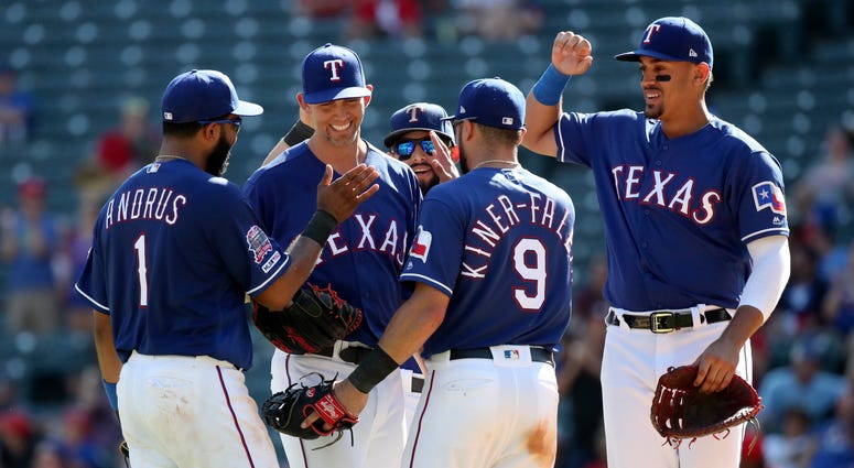 Arlington, TX, USA; Texas Rangers starting pitcher Mike Minor (23) celebrates with teammates during the ninth inning against the Boston Red Sox at Globe Life Park in Arlington. Arlington, TX, USA; Texas Rangers starting pitcher Mike Minor (23) celebrates with teammates during the ninth inning against the Boston Red Sox at Globe Life Park in Arlington.