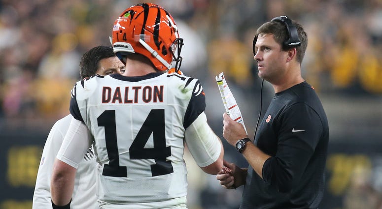 Sep 30, 2019; Pittsburgh, PA, USA; Cincinnati Bengals quarterback Andy Dalton (14) talks with head coach Zac Taylor (right) during a time out against the Pittsburgh Steelers during the second quarter at Heinz Field. Sep 30, 2019; Pittsburgh, PA, USA; Cincinnati Bengals quarterback Andy Dalton (14) talks with head coach Zac Taylor (right) during a time out against the Pittsburgh Steelers during the second quarter at Heinz Field.