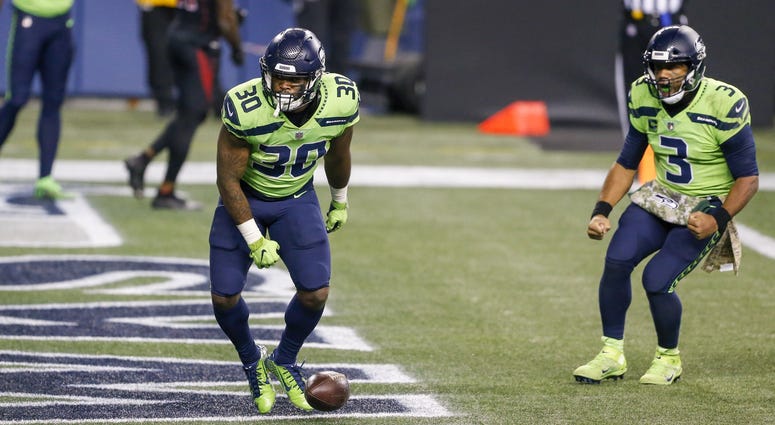 Russell Wilson and Carlos Hyde Russell Wilson and Carlos Hyde