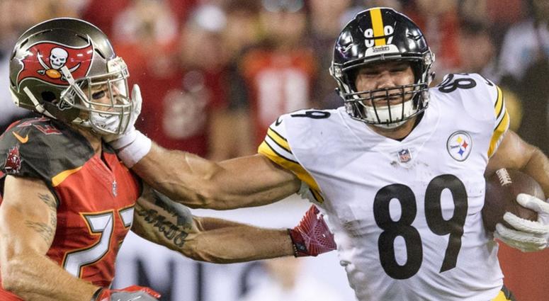 Vance McDonald and Chris Conte Vance McDonald and Chris Conte