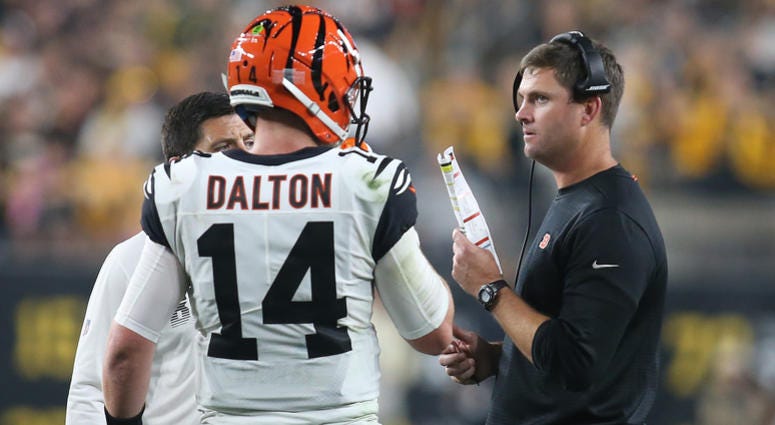 Sep 30, 2019; Pittsburgh, PA, USA; Cincinnati Bengals quarterback Andy Dalton (14) talks with head coach Zac Taylor (right) during a time out against the Pittsburgh Steelers during the second quarter at Heinz Field. Sep 30, 2019; Pittsburgh, PA, USA; Cincinnati Bengals quarterback Andy Dalton (14) talks with head coach Zac Taylor (right) during a time out against the Pittsburgh Steelers during the second quarter at Heinz Field.