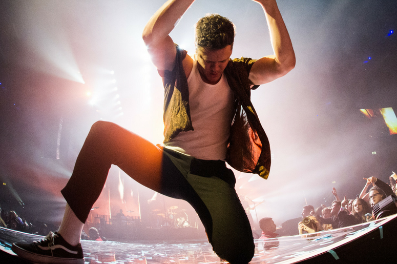 Dan Reynolds of Imagine Dragons performs live on stage at the Genting Arena in Birmingham, UK Dan Reynolds of Imagine Dragons performs live on stage at the Genting Arena in Birmingham, UK