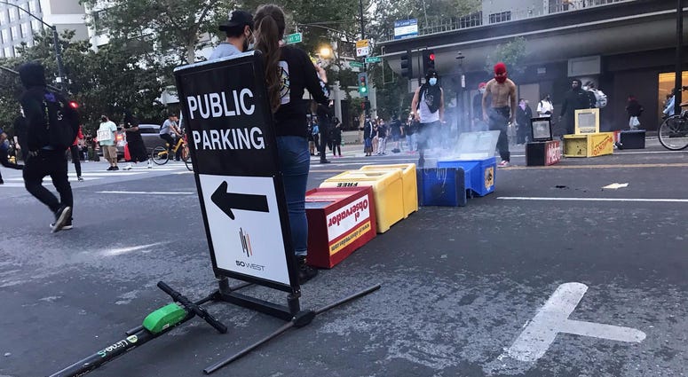 Newspaper stands dragged into the street.