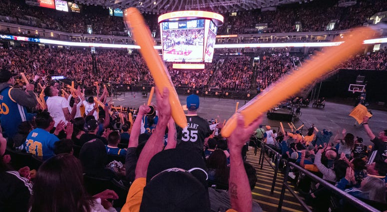 Golden State Warriors Watch Party at Oracle Arena A Golden State Warriors fan waves thunder sticks during a watch party for game four of the 2017 NBA Finals against the Cleveland Cavaliers at Oracle Arena. Mandatory Credit: Kelley L Cox-USA TODAY Sports