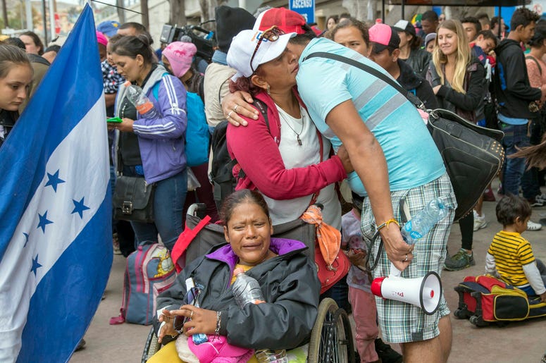 Central American Migrant Caravan Group April 29, 2018; Tijuana, Baja California, MEXICO; Part of the Central American migrant caravan group crossing Tijuana bridge. Some broke down crying just outside the entrance to the U.S. port at San Ysidro in Tijuana, on April 29, 2018. These migrants wil