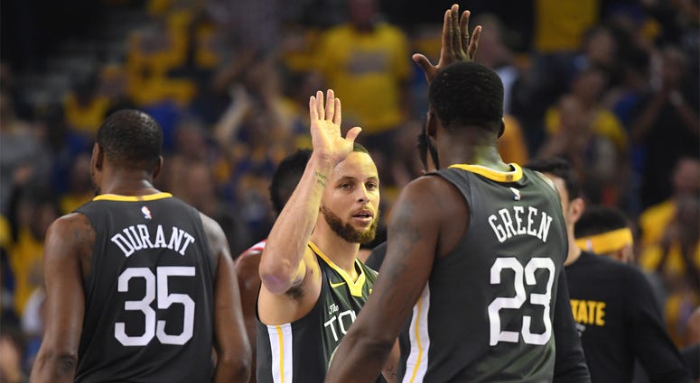 Golden State Warriors at NBA Finals 2018 May 22, 2018; Oakland, CA, USA; Golden State Warriors guard Stephen Curry (facing camera) high-fives forward Draymond Green (23) during the first quarter in game four of the Western conference finals of the 2018 NBA Playoffs against the Houston Rockets at