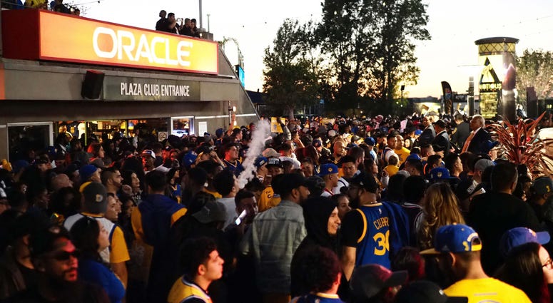 Golden State Warriors fans at Oracle Arena Jun 8, 2018; Oakland, CA, USA; Golden State Warriors fans celebrate in the plaza between Oracle Arena and Oakland Coliseum after the win against the Cleveland Cavaliers in game four of the 2018 NBA Finals. Mandatory Credit: Kelley L Cox-USA TODAY Sports