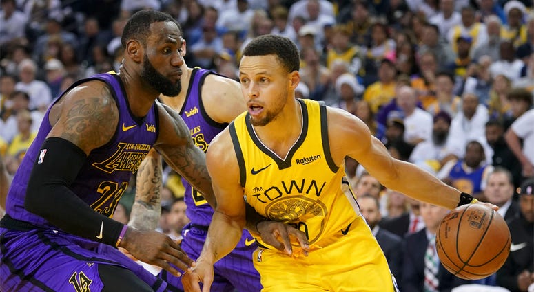 Los Angeles Lakers forward LeBron James and Golden State Warriors guard Stephen Curry December 25, 2018; Oakland, CA, USA; Golden State Warriors guard Stephen Curry (30) dribbles the basketball against Los Angeles Lakers forward LeBron James (23) during the third quarter at Oracle Arena. Mandatory Credit: Kyle Terada-USA TODAY Sports