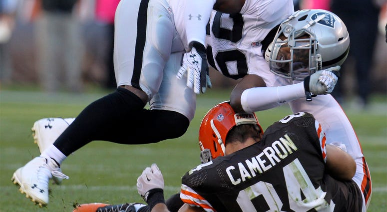 Oakland Raiders' Brandian Ross and Cleveland Browns' Jordan Cameron Cleveland Browns tight end Jordan Cameron left the game with a concussion after a hit by Oakland Raiders Brandian Ross during the second quarter on Sunday, Oct. 26, 2014, at FirstEnergy Stadium in Cleveland, Ohio. The Browns won the game 23-13. (Photo by