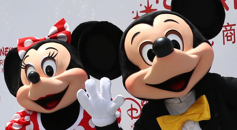 Minnie & Mickey Mouse (150520) -- SHANGHAI, May 20, 2015 (Xinhua) -- Disney characters Mickey (R) and Minnie Mouse are seen during the opening ceremony for the Disney flagship store in Shanghai, east China, May 20, 2015. The store, occupying an area of 5,860 square meters in t