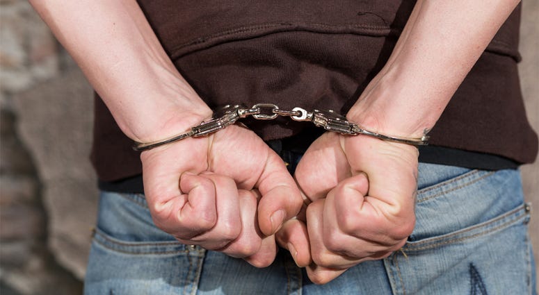 Man arrested and handcuffed suspect Man arrested and handcuffed suspect