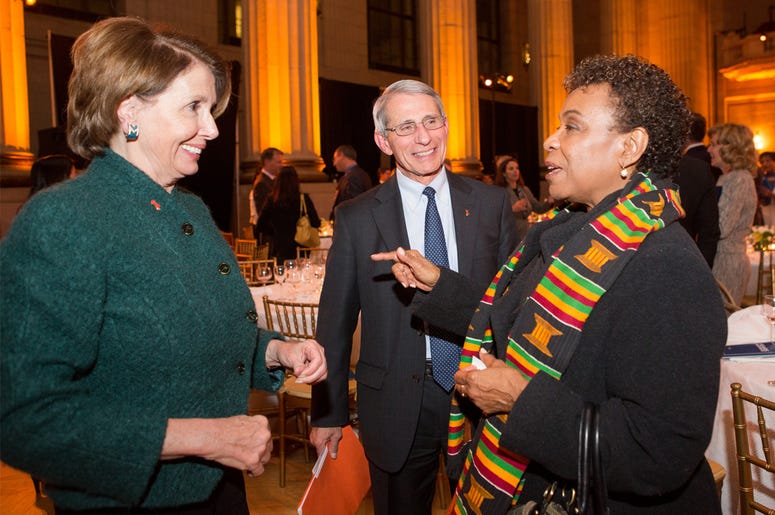 Rep. Nancy Pelosi (D-CA), U.S. House Minority Leader, Dr. Anthony Fauci, an immunologist and leading HIV/AIDS researcher, and Rep. Barbara Lee (D-CA) WASHINGTON, DC - DECEMBER 2: L to R, Rep. Nancy Pelosi (D-CA), U.S. House Minority Leader, Dr. Anthony Fauci, an immunologist and leading HIV/AIDS researcher, and Rep. Barbara Lee (D-CA), talk at the 10th anniversary leadership gala of the Friends Of The