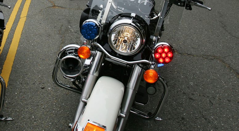 San Francisco Police / SFPD / Motorcycle SAN FRANCISCO - JUNE 03: Two athletes are attended to by fans and police after a crash during the bike portion of the Escape from Alcatraz Triathlon on June 3, 2007 in San Francisco, California. (Photo by Jed Jacobsohn/Getty Images)