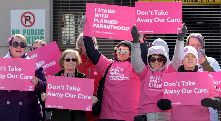 Planned Parenthood Protesters Planned Parenthood members from Nashville protest at Municipal Auditorium before the start of the rally by President Donald Trump.