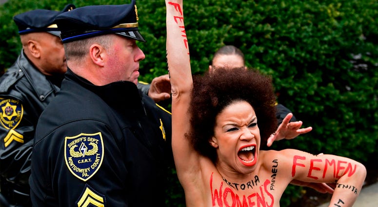 AP18099470295393 ADDS ID OF WOMAN - Actress Nicolle Rochelle, who appeared on several episodes of "The Cosby Show," is detained as Bill Cosby arrives for his sexual assault trial at the Montgomery County Courthouse, Monday, April 9, 2018, in Norristown, Pa. Rochelle of Li