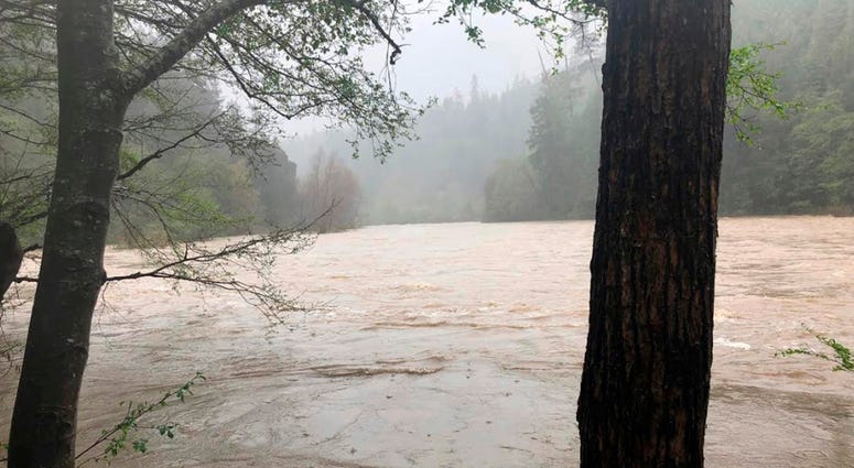 Eel River in Northern California File - This photo released April 12, 2018, by The Mendocino County Sheriff's Office shows the Eel River in Northern California. Authorities searching for a family whose SUV plunged into a rain-swollen Northern California river found the vehicle and the bo
