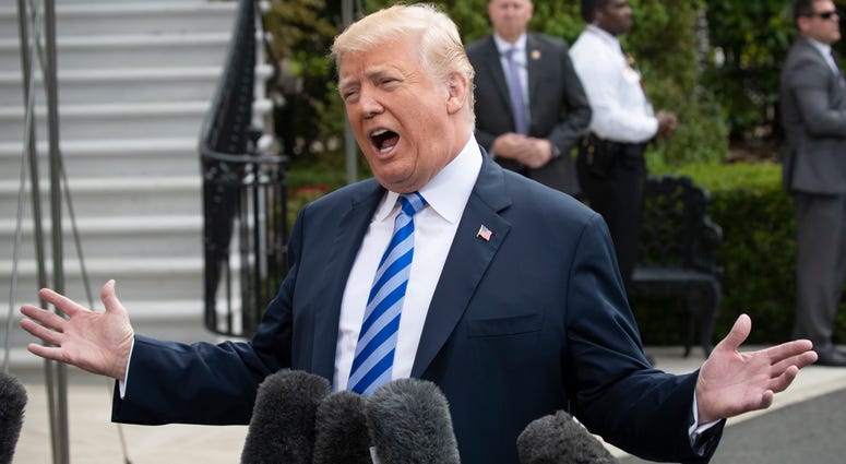 AP18124526461298 President Donald Trump talks to the media as he leaves for Dallas to address the National Rifle Association, Friday, May 4, 2018 at the White House in Washington. (AP Photo/J. Scott Applewhite)