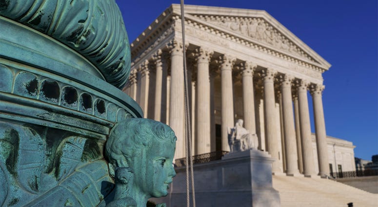 AP18130582218336 The Supreme Court is seen in Washington, April 20, 2018. The Supreme Court says employers can prohibit their workers from banding together to complain about pay and conditions in the workplace. (AP Photo/J. Scott Applewhite)