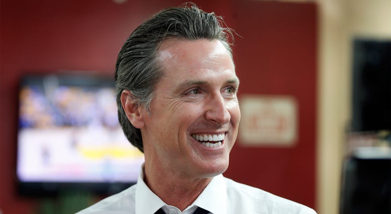 AP18155659366029 In this May 31, 2018 file photo Democratic Lt. Gov. Gavin Newsom smiles at a campaign stop at Stakely's Barber Salon in Los Angeles. Newson is expected to easily top the field in the race for govenor, but former Los Angeles Antonio Villaraigosa and state
