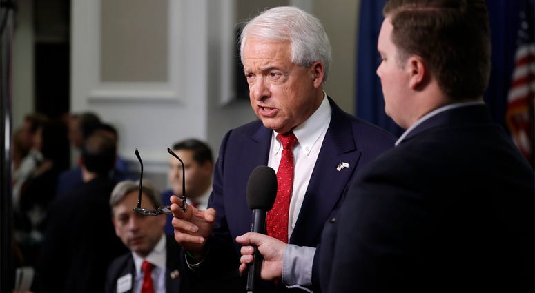 AP18157154025475 Republican gubernatorial candidate John Cox, center, speaks to reporters at a San Diego Republican election party Tuesday, June 5, 2018, in San Diego. The intrigue in the race to replace departing California Gov. Jerry Brown isn't who wins — it's who come
