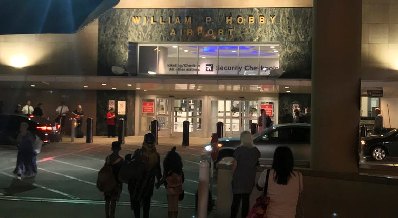 AP18158419196967 People wait outside Houston's William P. Hobby Airport on Thursday, June 7, 2018, after a toy grenade in a passenger's bag forced the shutdown of a security checkpoint, inconveniencing hundreds of people catching early-morning flights. (AP Photo/John L. M