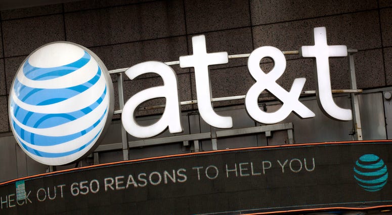 AP18163449200160 In this Monday, Oct. 24, 2016, file photo, the AT&T logo is positioned above one of its retail stores, in New York. The fate of the AT&T-Time Warner merger, a massive media deal opposed by the government that could shape how much consumers pay for streami
