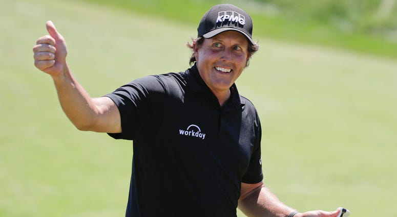 AP18168576279629 Phil Mickelson reacts after sinking a putt on the 13th hole during the final round of the U.S. Open Golf Championship, Sunday, June 17, 2018, in Southampton, N.Y.