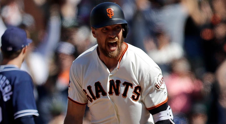 AP18175842215285 San Francisco Giants' Hunter Pence, center, celebrates after his bases-loaded walk-off double against the San Diego Padres during the eleventh inning of a baseball game Sunday, June 24, 2018, in San Francisco. San Francisco won 3-2.
