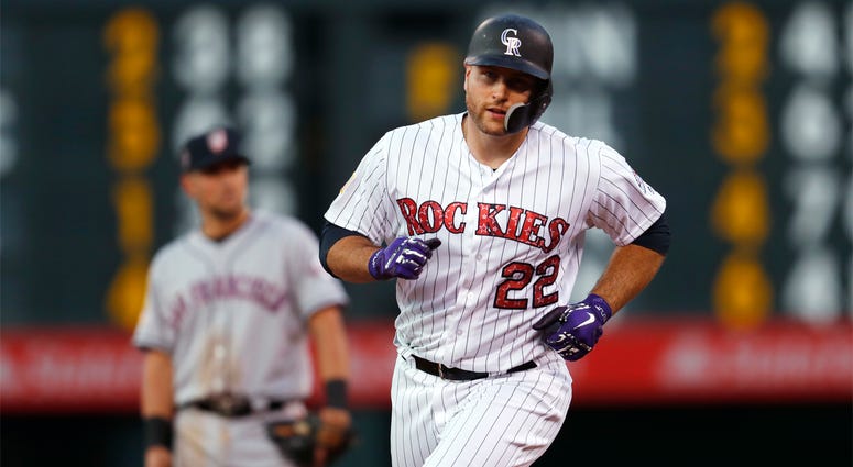 AP18186087857124 Colorado Rockies' Chris Iannetta circles the bases after hitting a solo home run off San Francisco Giants starting pitcher Andrew Suarez during the seventh inning of a baseball game Wednesday, July 4, 2018, in Denver. (AP Photo/David Zalubowski)