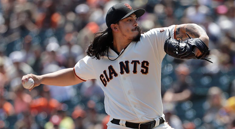 AP18224743370418 San Francisco Giants pitcher Dereck Rodriguez throws against the Pittsburgh Pirates during the first inning of a baseball game in San Francisco, Sunday, Aug. 12, 2018. (AP Photo/Jeff Chiu)
