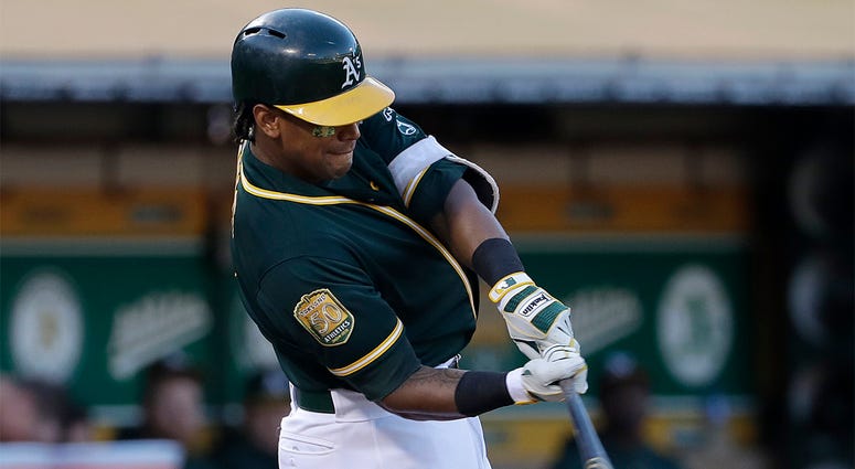 AP18236818923998 In this Aug. 4, 2018 file photo, Oakland Athletics' Khris Davis hits a solo home run against the Detroit Tigers during the third inning of a baseball game in Oakland, Calif. Davis has certainly contemplated the idea of hitting 50 home runs. The Oakland sl