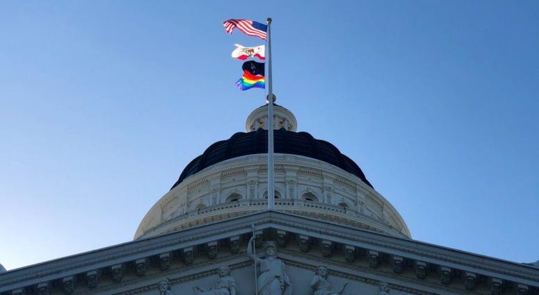 The LGBTQ pride flag flies at the California state capitol in Sacramento on June 17, 2019. The LGBTQ pride flag flies at the California state capitol in Sacramento on June 17, 2019.