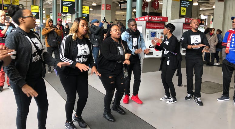 Singers that rode the Celebration Trade, which took riders from the South Bay to San Francisco to attend the MLK Day march, serenade the crowd at 4th Street CalTrain station in San Francisco on Monday, 20th, 2020.