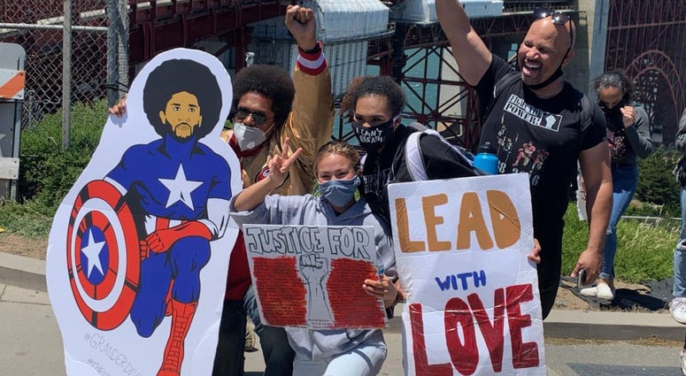 The rally's organizer, 17-year-old Tiana Day, seen (center) with other protesters.