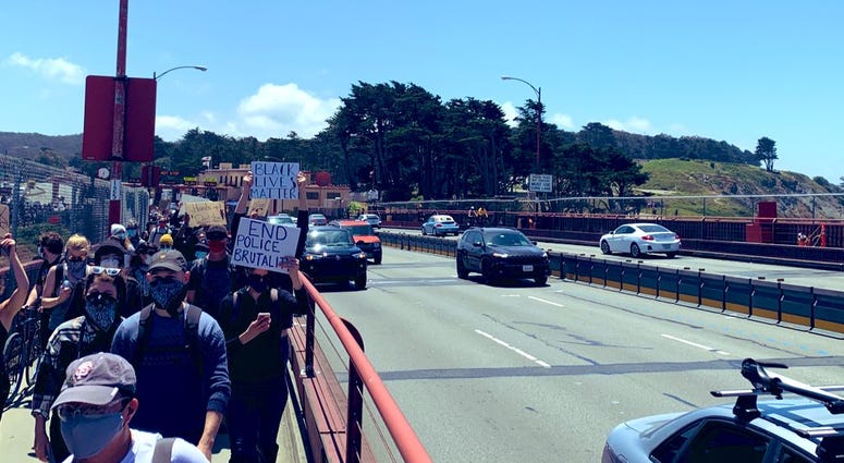 Protesters march across the Golden Gate Bridge in support of the Black Lives Matter movement.