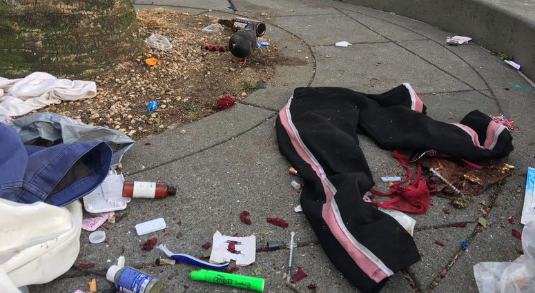Garbage, including a discarded needle, piles up in Embarcadero Plaza on June 10, 2019. Garbage, including a discarded needle, piles up in Embarcadero Plaza on June 10, 2019.