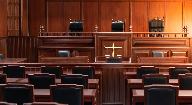 A view of an empty courtroom.