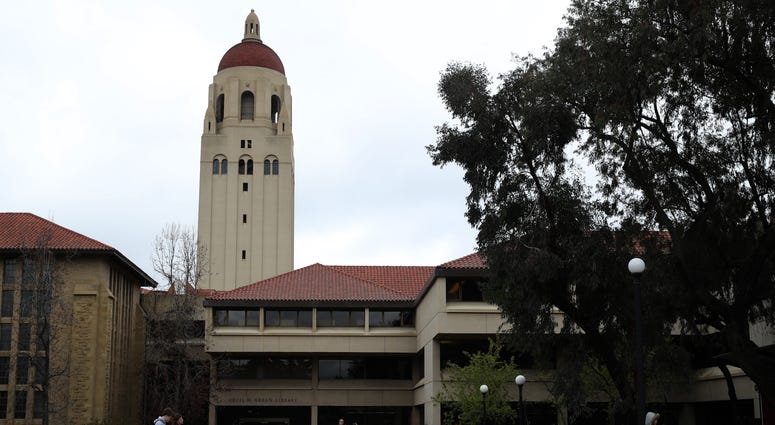 People walk by Hoover Tower on the Stanford University campus on March 12, 2019 in Stanford, California. People walk by Hoover Tower on the Stanford University campus on March 12, 2019 in Stanford, California.